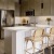 a kitchen with a bar and bar stools